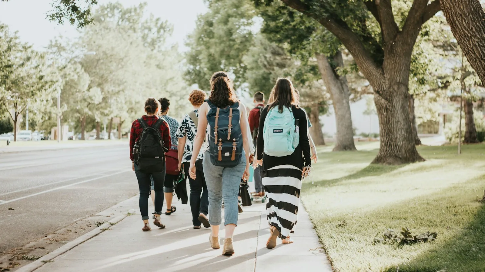 Students walking across a university campus