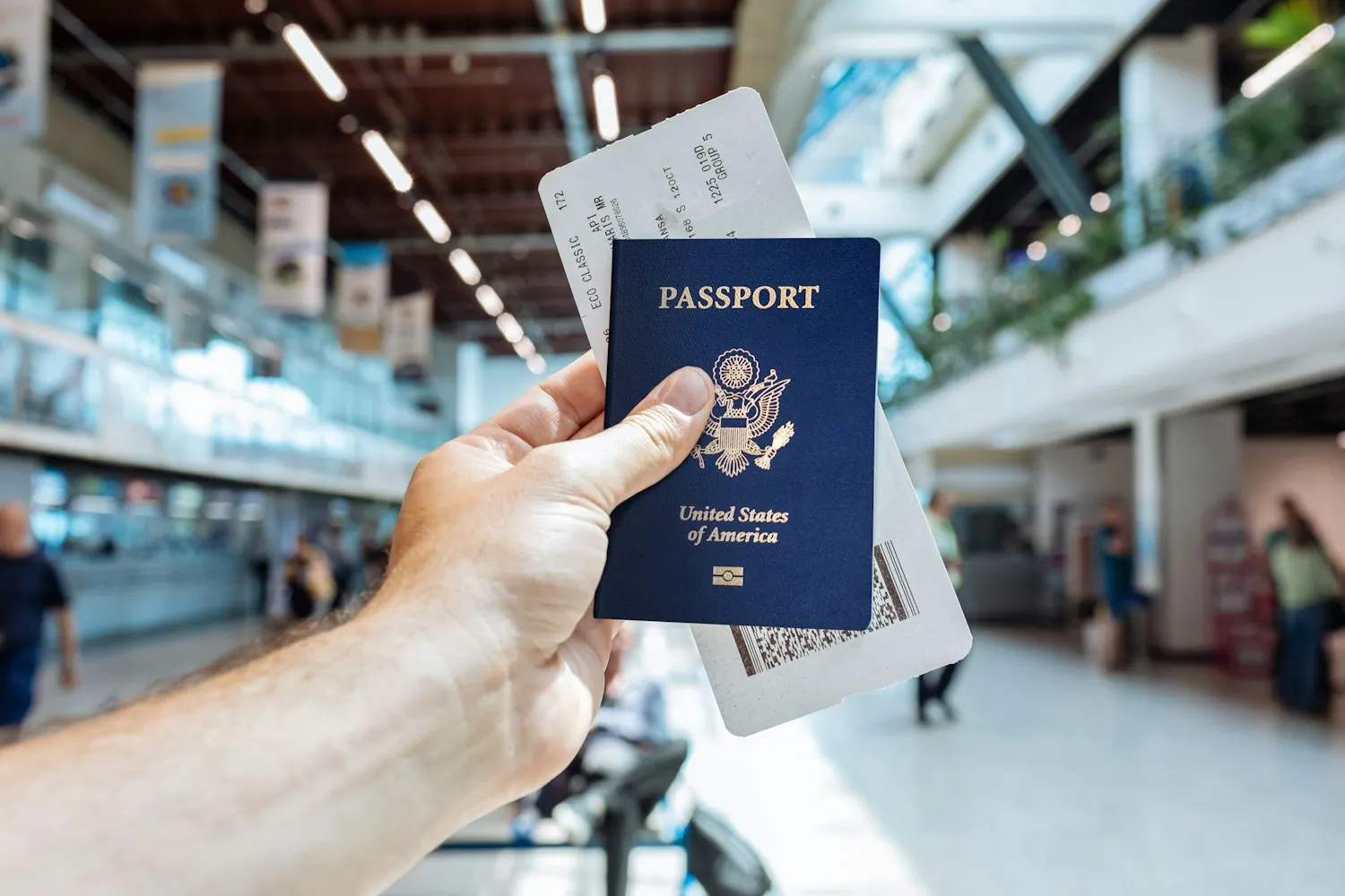A passport held up at an airport