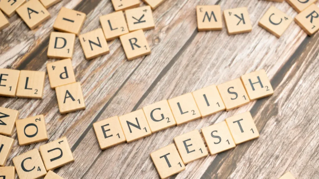 কাঠের অক্ষরে লেখা English Test