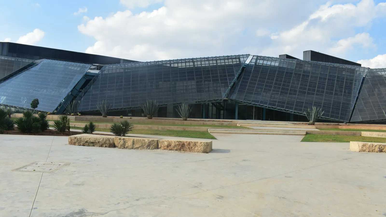 A modern university building in Cyprus under a blue sky