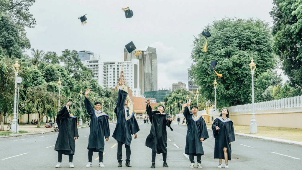 Graduates throwing their caps in the air