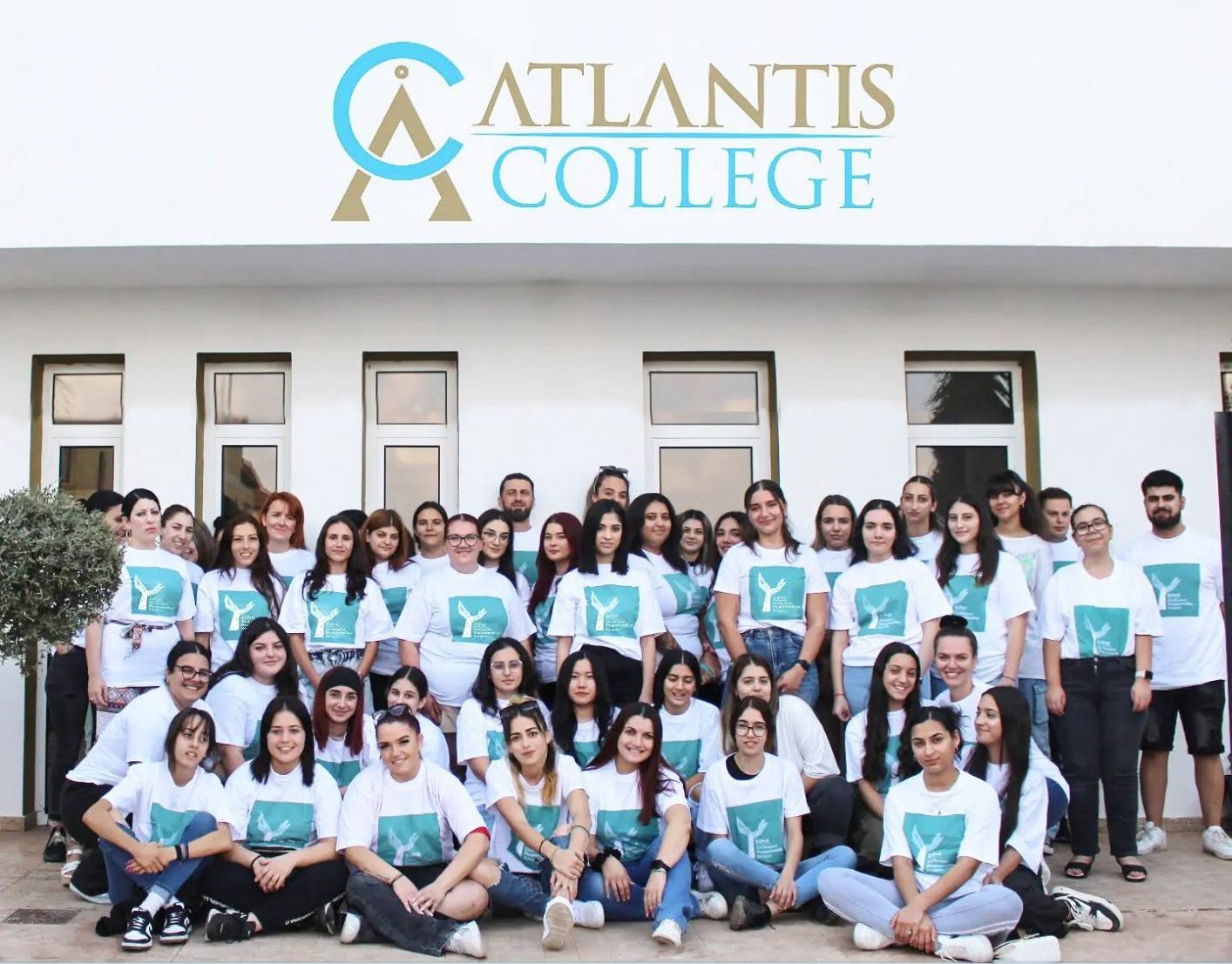 Atlantis College students gathered in front of the college building