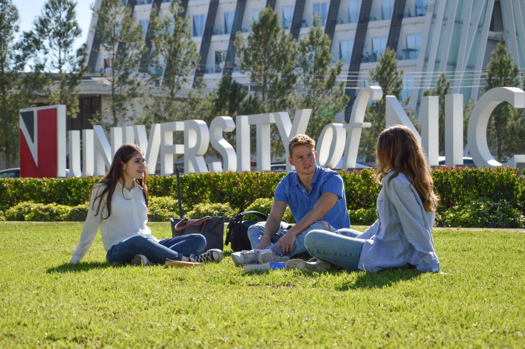 University of Nicosia campus with students on the lawn