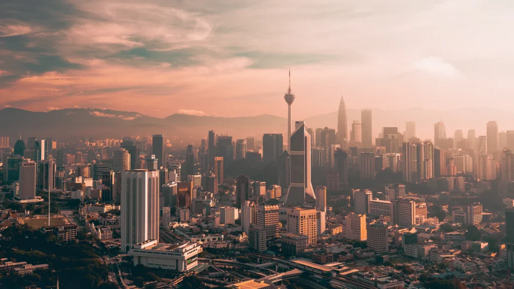 Aerial view of Kuala Lumpur towers at sunset
