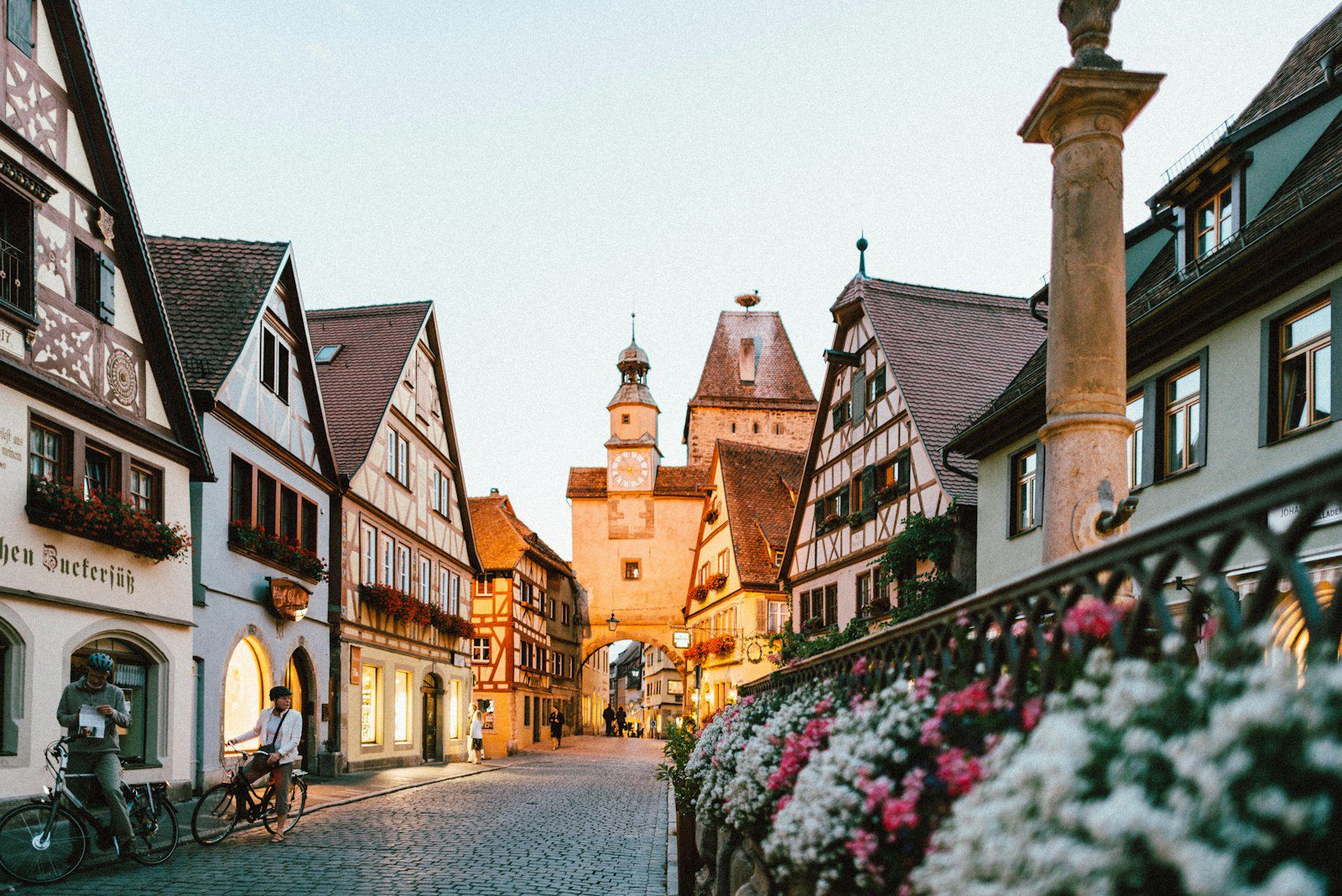 Historic European town street with flowers