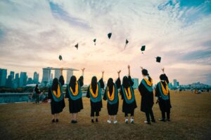 Graduates throwing caps into the air